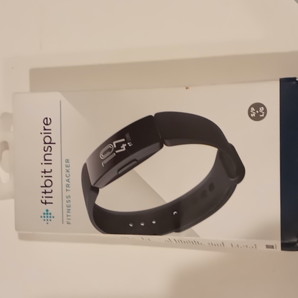 Black Fitbit Aspire.